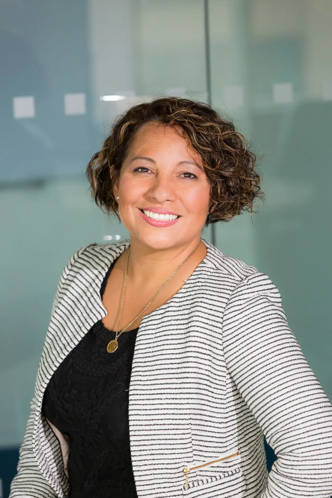 A smiling professional in an office