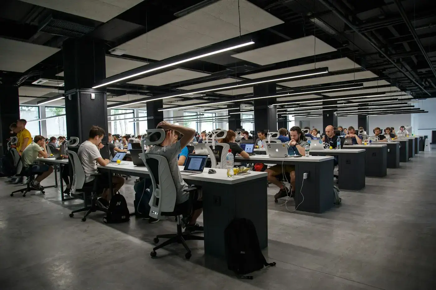 An open-plan office with people at computers